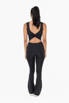 Our Laguna Twist Back Jumpsuit is designed to make you look and feel fabulous. Crafted with premium fabric and featuring a flare leg, open back, and square neckline, this jumpsuit flatters any figure. Not to mention, it comes with built-in bra support and thick, supportive straps for ultimate comfort and security. For the modern millennial woman, this jumpsuit is a must-have!      75% Polyester, 25% Spandex     True to Size fit, snug fit     Flare leg     Machine was cold, hang dry.
