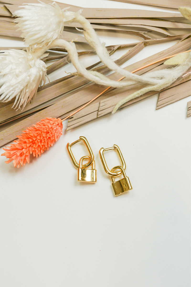 -Lock Earrings-  Accessorize your outfit with these adorable gold earrings.