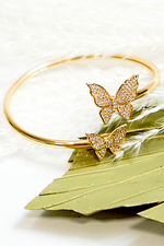 -Butterfly Cuff-  CZ crystal butterfly cuff makes for a great addition for an arm stack or by itself for a statement piece. Adjustable to fit.