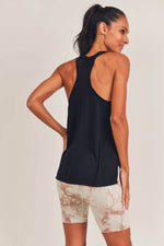 -Christa Race Tank-  You will love this lightweight tank top with just the right amount of stretch and casual fit. The scoop neck and arm hole design is just right. You know we are all about layering, so wear this year round under any of our crop tops or sporty cardigans. The micro perforation provides detailed styling and a cooling effect.  85% Nylon, 15% Spandex Machine wash, Hang dry or low temp dry Moisture-wicking 4-way stretch