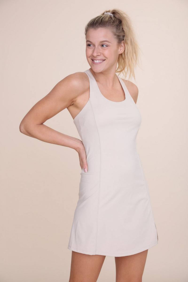 -Twin Strap Athletic Dress-  This active dress is fun and functional for tennis and the golf course. This style comes without attached short for the convenience of not having to remove the entire piece for bathroom breaks. Made with recycled fabrics!   75% Recycled Nylon, 25% Spandex, Machine wash cold.