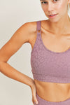 -Leopard Texture Sports Bra-  We love the gorgeous leopard jacquard texture of this sports bra. It provides medium support for low to medium impact activities. The Peekaboo back details ads a little something extra.  adjustable straps 85% TACTEL, 15% Spandex Removable bra pads Breathable fabric that dries 8x faster than cotton 