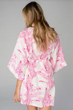 -Tropical Pink Palm Robe-  Our robe recently got an upgrade to a buttery silky fabric that we absolutely LOVE. This is a luxe satin-like material with kimono style short sleeves, tie closure and a perfect fit. This robe is a great gift to or treat yourself as part of your self care ritual.  One Size 33" in length. 100% Polyester. Machine wash cold and hang dry.