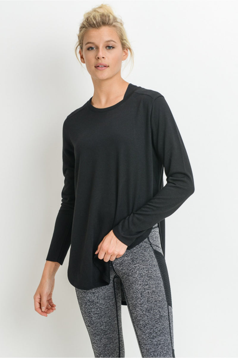 -Abby Side Slit Tunic-  You want to add this to your wardrobe basics. This longer length tunic is versatile to dress up or down. The side slits add just the right amount of detail and style.  70% Polyester, 30% Viscose Machine wash cold, hang dry or tumble dry Fit: Runs to to size in Womens. Loose fit.
