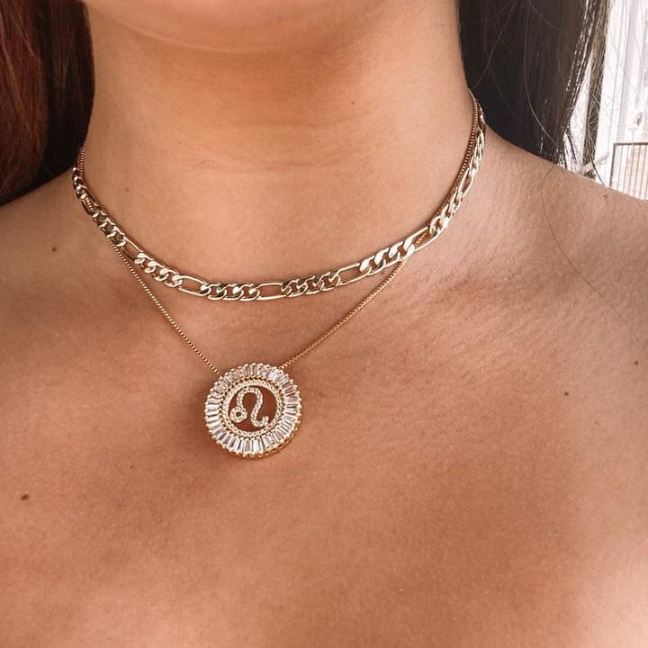 -Zodiac Radiant Necklace-  No one has to guess whether your are an emotional Cancer or a stubborn Taurus. We love these necklaces and they are available in your sign!   18k gold plated brass with clear crystals, 16” length with 1” extension, Zodiac pendant is 1.5” in diameter.